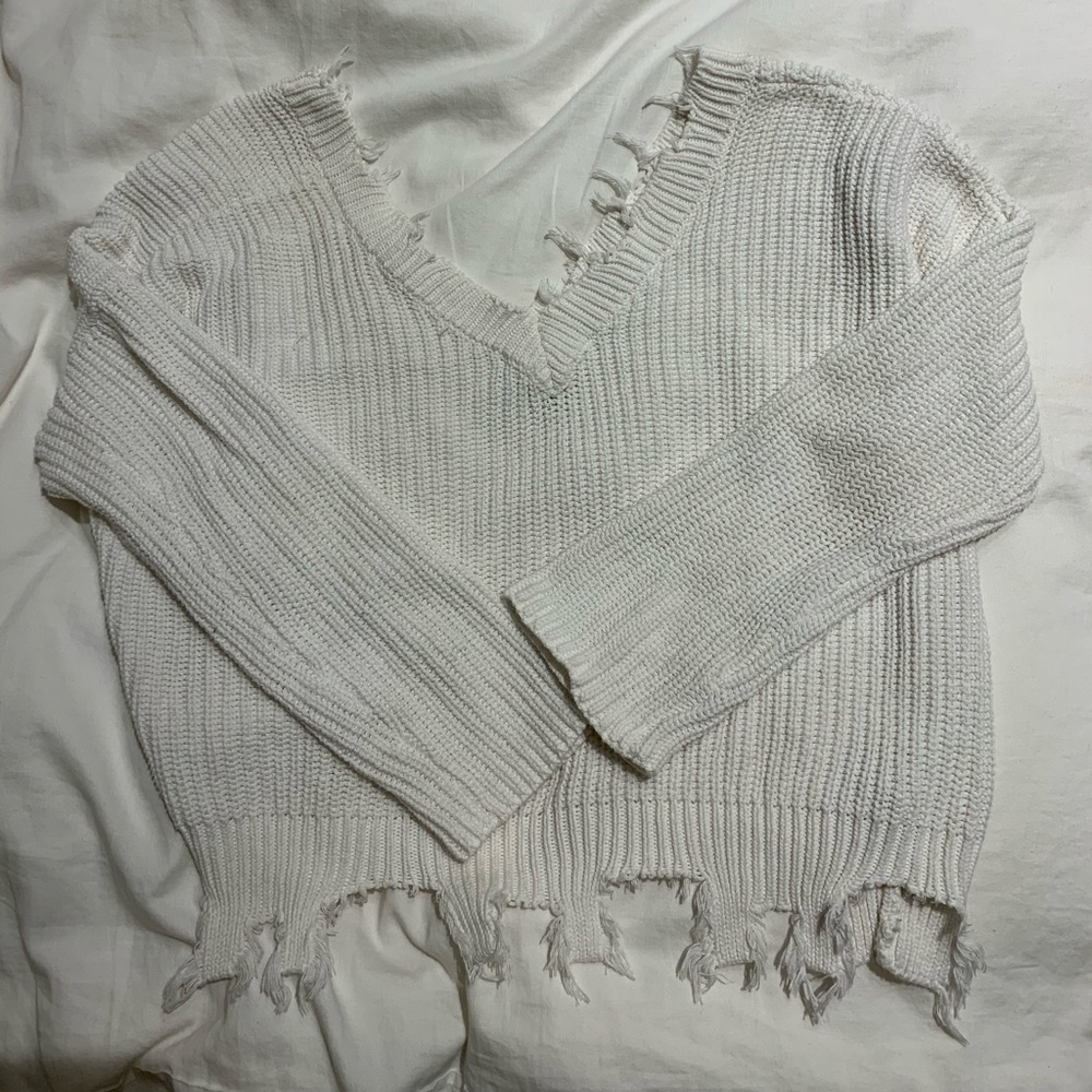 white frayed sweater
